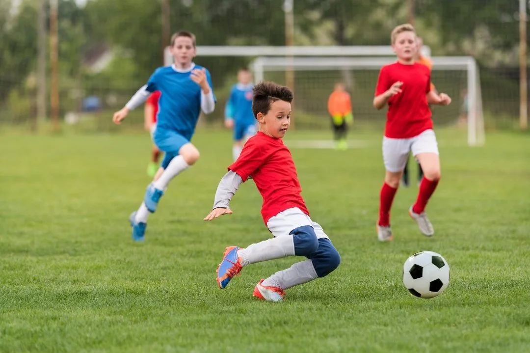 Photo of children playing soccer